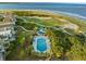 Stunning aerial view of a beachfront property with pool, landscaping and ocean views at 10 Ocean Point Dr, Isle of Palms, SC 29451