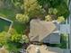Birds eye view of a landscaped home with a pool surrounded by lush foliage at 10 Ocean Point Dr, Isle of Palms, SC 29451
