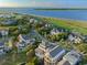 Beautiful aerial view of waterfront homes surrounded by a lush green landscape at 10 Ocean Point Dr, Isle of Palms, SC 29451
