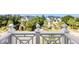 Panoramic balcony view showcases neighborhood, lush greenery, ocean, and homes at 10 Ocean Point Dr, Isle of Palms, SC 29451