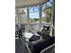 Screened in porch featuring a seating area with a view of the nearby pond and golf course at 10 Ocean Point Dr, Isle of Palms, SC 29451