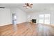 Spacious living room with fireplace, ceiling fan, and access to the exterior through sliding doors at 101 Stoneybrea Ct, Goose Creek, SC 29445