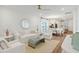 Open-concept living room with hardwood floors, modern furniture, and bright lighting at 1030 Sagegrass St, Summerville, SC 29485