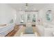 Bright and airy living room with hardwood floors, a ceiling fan, and modern decor at 1030 Sagegrass St, Summerville, SC 29485