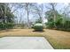 Spacious backyard featuring a concrete patio, a shed, green trees and a lawn at 1043 Dominion Dr, Hanahan, SC 29410