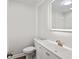 Modern bathroom featuring a sleek toilet, vanity, and illuminated mirror at 1043 Dominion Dr, Hanahan, SC 29410