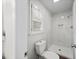 Bright bathroom featuring a shower with white tiles, shower head and window at 1043 Dominion Dr, Hanahan, SC 29410