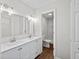 Bright bathroom featuring double sinks, vanity with drawers, and glass enclosed shower at 1043 Dominion Dr, Hanahan, SC 29410