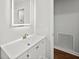 Bathroom featuring a modern sink, vanity, and a sleek, illuminated mirror at 1043 Dominion Dr, Hanahan, SC 29410