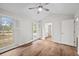 Bedroom with hardwood floors, multiple windows, ceiling fan and access to bathroom at 1043 Dominion Dr, Hanahan, SC 29410