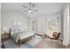 Cozy bedroom featuring natural light, wood floors, and a ceiling fan at 1043 Dominion Dr, Hanahan, SC 29410