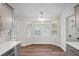 Sunlit kitchen nook with a bay window offering views of the outdoors, next to stainless steel appliances and a laundry room at 1043 Dominion Dr, Hanahan, SC 29410