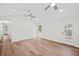Bright living room with wood floors, white walls, ceiling fan, recessed lighting, and natural light at 1043 Dominion Dr, Hanahan, SC 29410