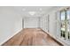 Bright, spacious living room featuring hardwood floors, fresh paint, recessed lights and plantation shutters at 1043 Dominion Dr, Hanahan, SC 29410