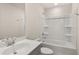 Bathroom featuring a modern vanity, mirror, toilet, and shower-tub combo at 105 Pen Shell St, Summerville, SC 29485