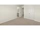 Neutral bedroom showcasing carpet, closet, ensuite bath entrance at 105 Pen Shell St, Summerville, SC 29485