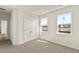 Bedroom with double windows overlooking a serene lake view and ample closet space at 105 Pen Shell St, Summerville, SC 29485