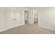 Carpeted bedroom featuring closet doors and a view to the bathroom at 105 Pen Shell St, Summerville, SC 29485