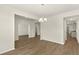 Open concept dining room featuring wood floors and a view into the kitchen area at 105 Pen Shell St, Summerville, SC 29485