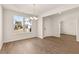 A dining room with bright, natural light, wood flooring, and modern light fixture at 105 Pen Shell St, Summerville, SC 29485