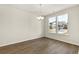 Bright dining area with hardwood floors, a chandelier, and large windows at 105 Pen Shell St, Summerville, SC 29485