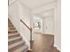 Inviting foyer with hardwood floors, a staircase, and a glimpse into the bright living spaces at 105 Pen Shell St, Summerville, SC 29485