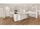 Modern kitchen with granite countertops, stainless appliances, and a spacious center island at 105 Pen Shell St, Summerville, SC 29485