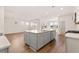 Large kitchen island with gray cabinetry and quartz countertops, perfect for meal preparation at 105 Pen Shell St, Summerville, SC 29485