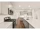 Bright kitchen boasts quartz counters, stainless steel appliances and a gas range at 105 Pen Shell St, Summerville, SC 29485