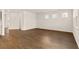 A spacious living room featuring beautiful wood floors, neutral paint and lots of natural light at 105 Pen Shell St, Summerville, SC 29485