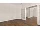 A living room featuring wood floors and French doors leading to another room at 105 Pen Shell St, Summerville, SC 29485