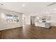 Open-concept living room showcases hardwood floors and natural light flowing into the kitchen at 105 Pen Shell St, Summerville, SC 29485
