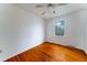 This bedroom features hardwood floors, a ceiling fan, and a bright window at 1075 Quail Dr, Charleston, SC 29412