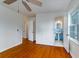 Bedroom with hardwood floors leads to a vintage bathroom with blue tile at 1075 Quail Dr, Charleston, SC 29412