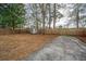 Large back yard featuring a privacy fence, mature trees, and a storage shed on a concrete slab at 111 Kennington Dr, Goose Creek, SC 29445