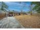 Spacious yard with privacy fencing that backs to mature trees and a covered porch at 111 Kennington Dr, Goose Creek, SC 29445