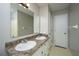 Clean bathroom offering double sinks, granite countertops, and a large mirror with lighting at 111 Kennington Dr, Goose Creek, SC 29445