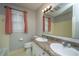 Bright bathroom featuring double sinks with granite countertops and a large mirror with good light fixtures at 111 Kennington Dr, Goose Creek, SC 29445