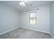 Empty bedroom with carpet floors, a window, ceiling fan and neutral walls at 111 Kennington Dr, Goose Creek, SC 29445