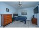 Comfortable bedroom with ceiling fan, a queen-sized bed, and dark wood furnishings at 111 Kennington Dr, Goose Creek, SC 29445