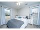 Cozy bedroom with two large windows and a comfortable bed with blue and pink accent pillows at 111 Kennington Dr, Goose Creek, SC 29445