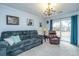Comfortable living room with a plush sofa, chair, and sliding glass doors at 111 Kennington Dr, Goose Creek, SC 29445