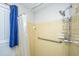 Bathroom shower with a safety handle, blue curtain and shower caddy at 111 Kennington Dr, Goose Creek, SC 29445