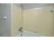 Classic bathtub and shower combination featuring a light-yellow tile surround and chrome fixtures at 111 Kennington Dr, Goose Creek, SC 29445
