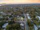 Aerial view of 1119 Simmons St in a neighborhood surrounded by lush trees with a glimpse of Charleston in the distance at 1119 Simmons St, Mount Pleasant, SC 29464