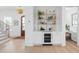 Stylish bar area with wine cooler, marble countertop, and decorative shelving, perfect for entertaining guests at 1119 Simmons St, Mount Pleasant, SC 29464