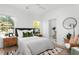 Modern bedroom with a stylish bed, unique decor, and ensuite bathroom access at 1119 Simmons St, Mount Pleasant, SC 29464