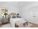 Bright bedroom showcasing a comfortable bed, neutral decor, and natural light from windows at 1119 Simmons St, Mount Pleasant, SC 29464