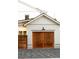 A wooden door of an attached garage complements the home's exterior at 1119 Simmons St, Mount Pleasant, SC 29464