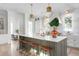 Spacious kitchen with an island, marble countertops, pendant lighting, and seating for four at 1119 Simmons St, Mount Pleasant, SC 29464